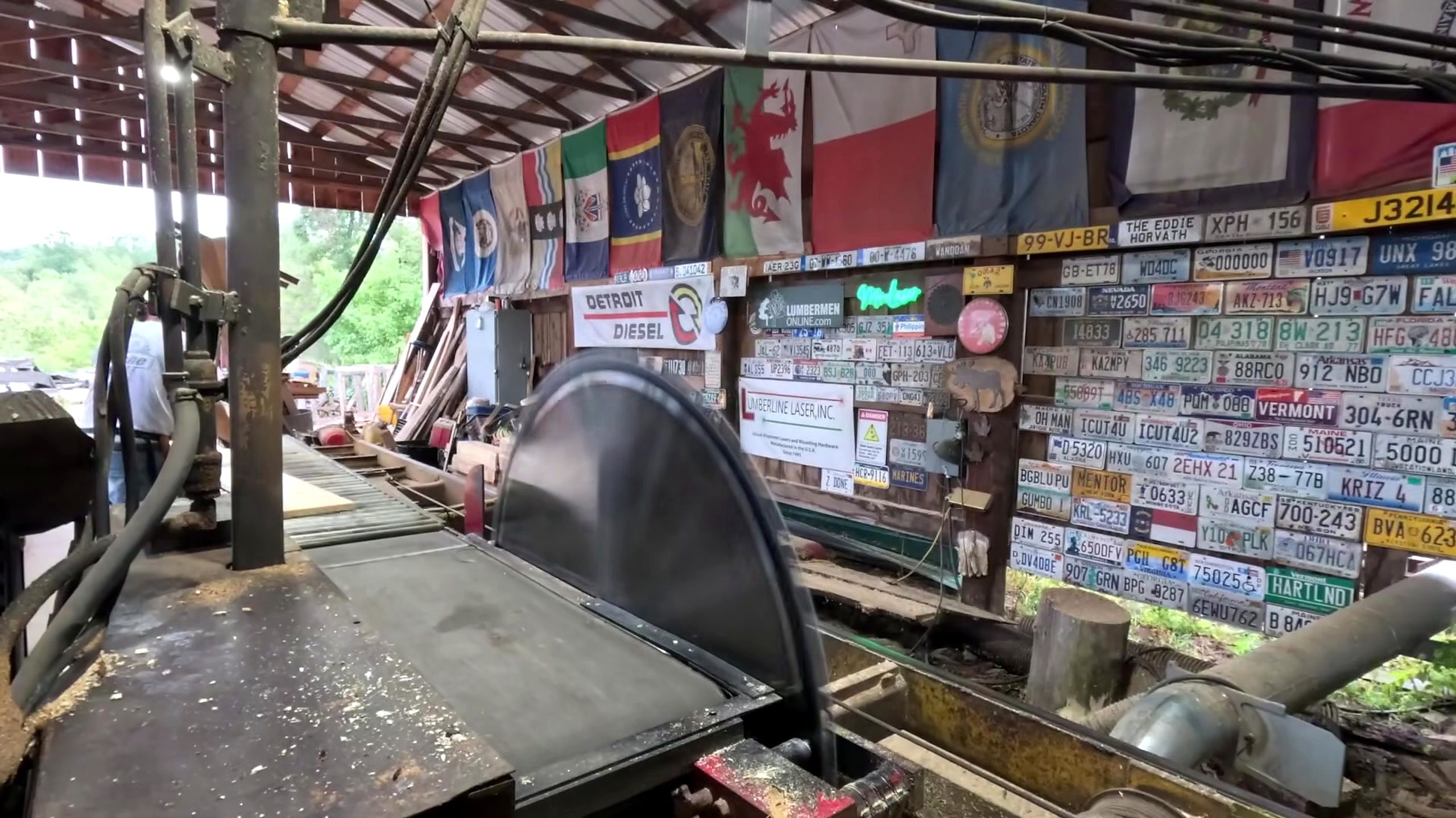 sawmill chop saw blade and log crosscut workflow - the circular blade, roller path, and operator zone during the cutting sequence