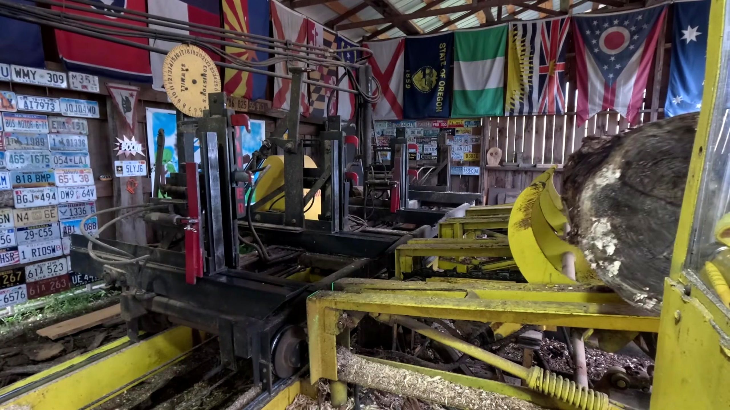 sawmill chop saw blade and log crosscut workflow - the carriage restraints and hydraulic structures controlling the log