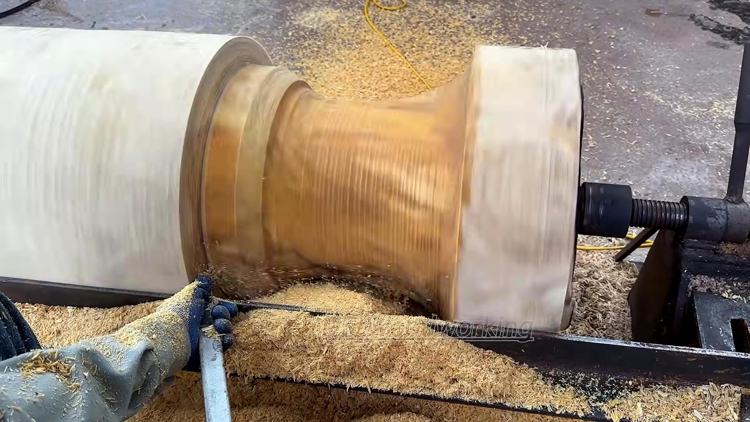 giant burnt log woodturning process - the main work stage that carries the keyword intent