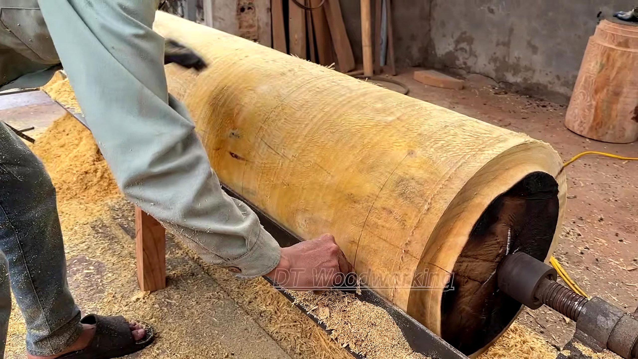 giant burnt log woodturning process - the setup or early workflow visible in the source video