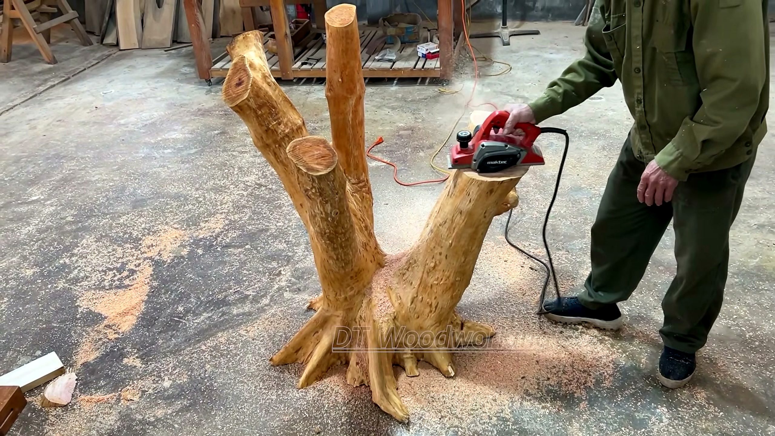 large tree stump - the setup or early workflow visible in the source video