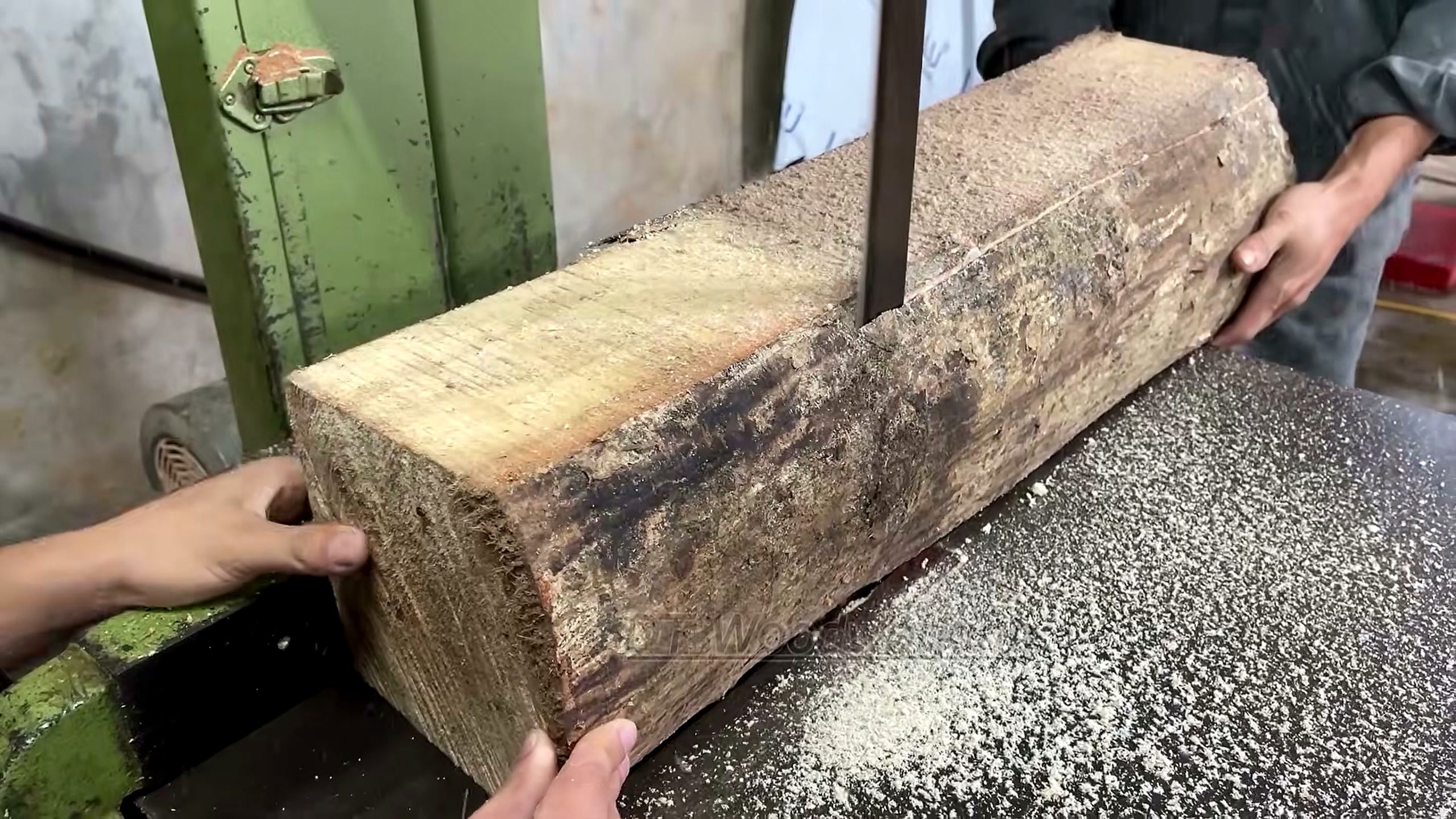 solid black wood slab - the setup or early workflow visible in the source video